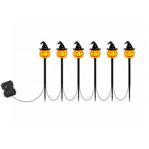 Six Halloween yard stake lights with orange jack-o'-lantern faces, black witch hats, and black stakes, shown with a black power box on a white background.