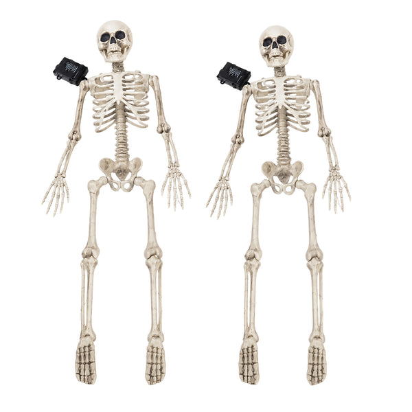 Two plastic skeleton floor decorations with black plastic eyes and black plastic ankles, shown side by side on a white background.