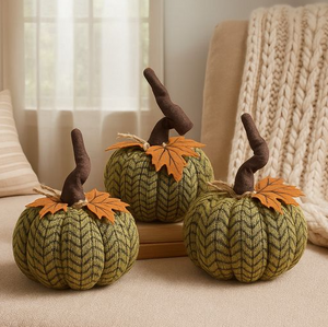 Three medium handcrafted plush pumpkins