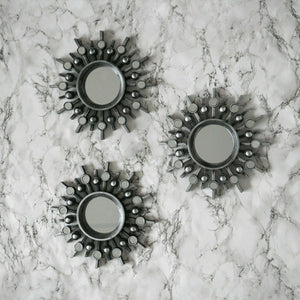 Set of three silver sunburst wall mirrors