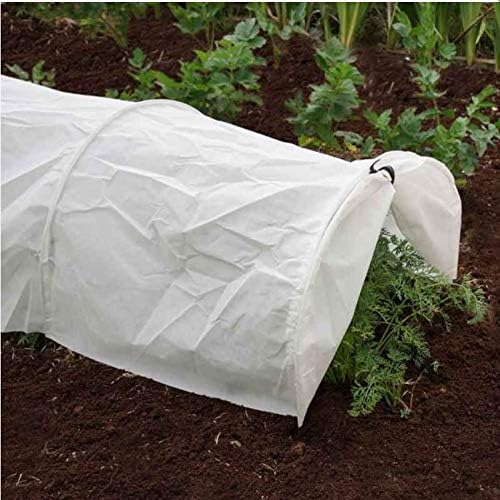 White fleece polytunnel greenhouse over raised garden bed.