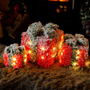 Three red and green frosted LED Christmas gift boxes