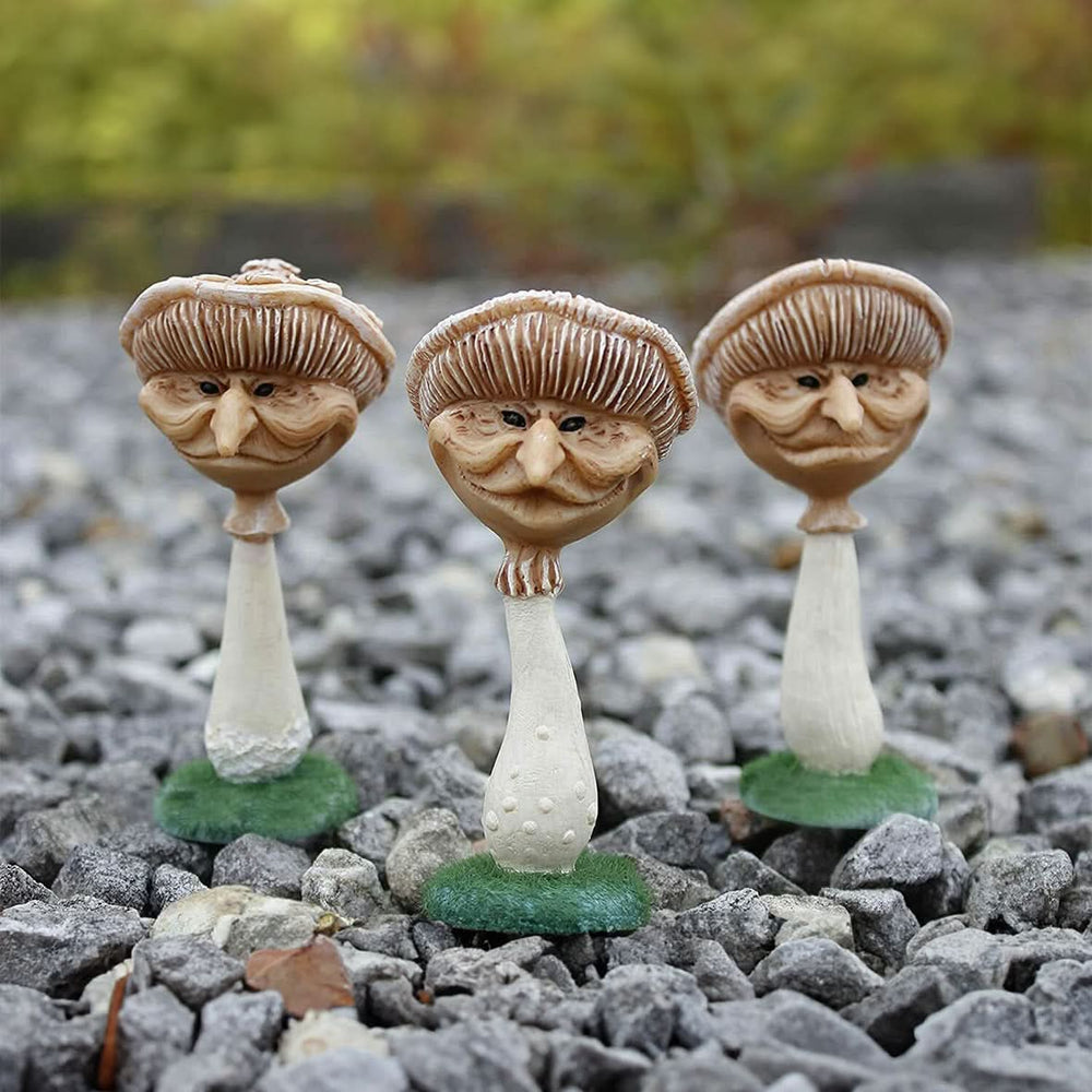 Three miniature resin mushroom garden ornaments