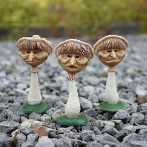 Three miniature resin mushroom garden ornaments