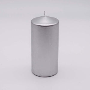 Silver candle on a light gray background