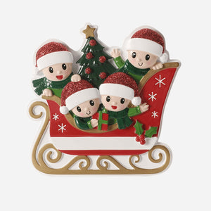 Christmas ornament with four elves on a sleigh with a tree and presents.