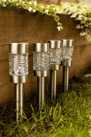 Faceted glass solar lights illuminated after dark
