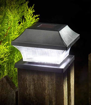 Four black solar post lights with bright white LEDs