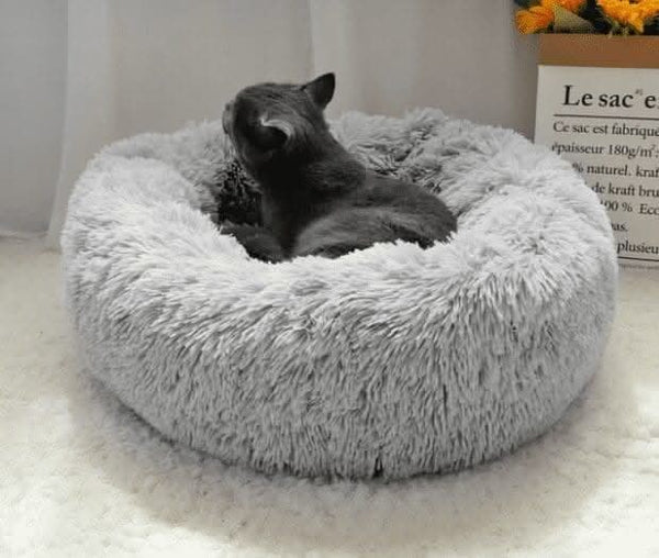 Round plush pet sleeping bed shown from above