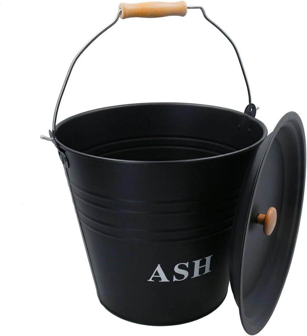 Black 'ASH' bucket on a fireplace hearth with flames in the background
