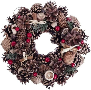Decorative wreath with pinecones, berries, and other natural elements on a white background