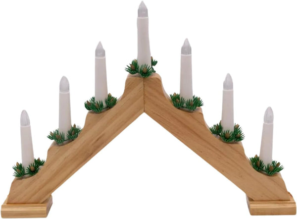 Wooden candle holder with white candles and greenery on a white background