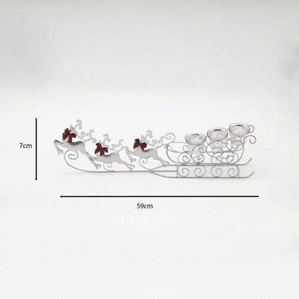 Decorative metal sleigh with reindeer on a white background