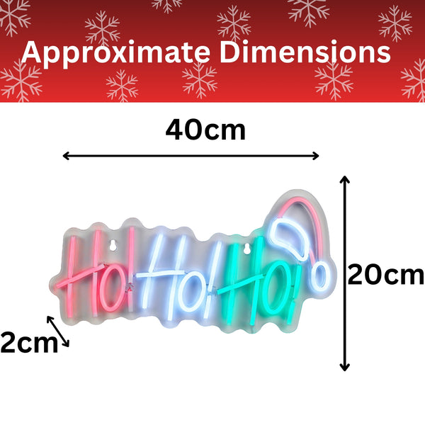 A neon-style 'Holly Holi' sign shown with approximate dimension arrows and labels: 40 cm wide, 20 cm tall, and 2 cm thick, on a white background with a red header containing snowflake graphics and the text 'Approximate Dimensions'.
