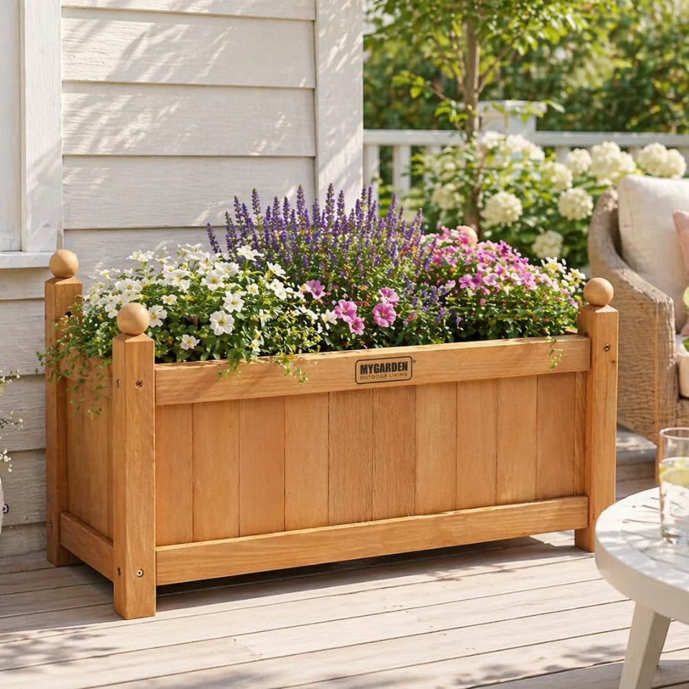 Brown wooden garden planter with flowering plants.