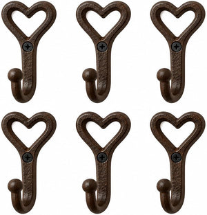 Six dark brown cast iron heart-shaped coat hooks arranged in two rows of three on a plain white background.