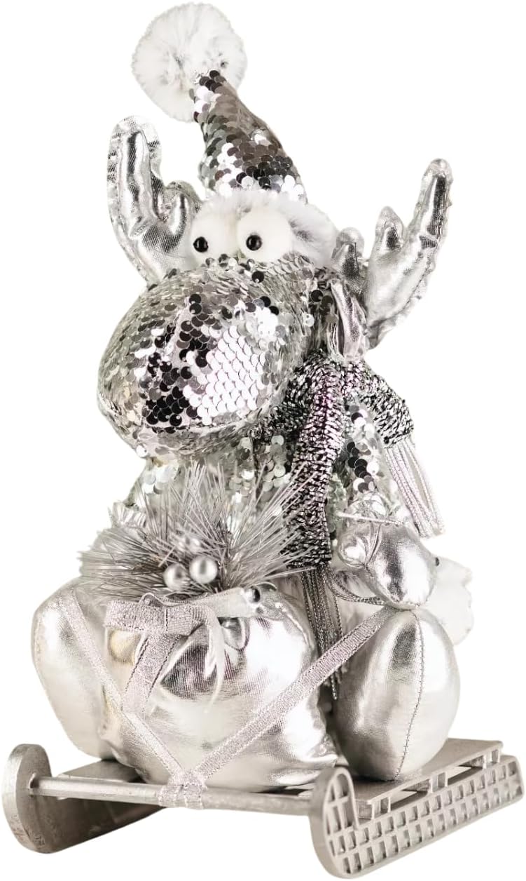 Decorative silver reindeer figure with a small snowman on its back, set against a blurred indoor background.