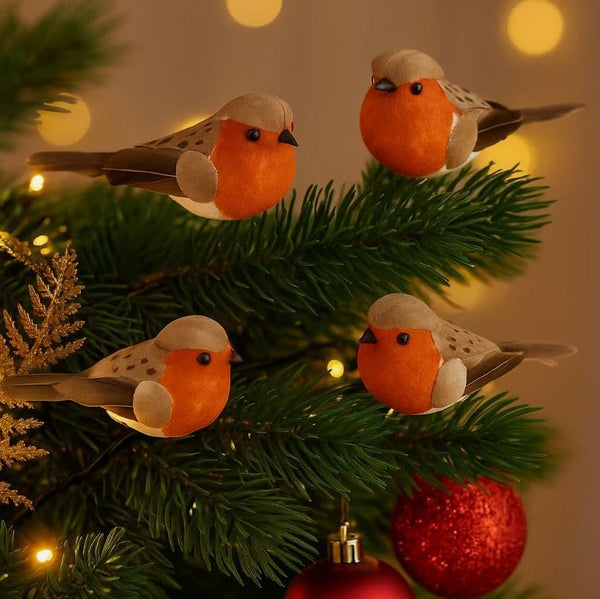 Decorative robin birds on a Christmas tree with lights and ornaments.