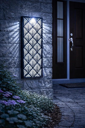 Decorative outdoor light fixture on a stone wall with a door in the background