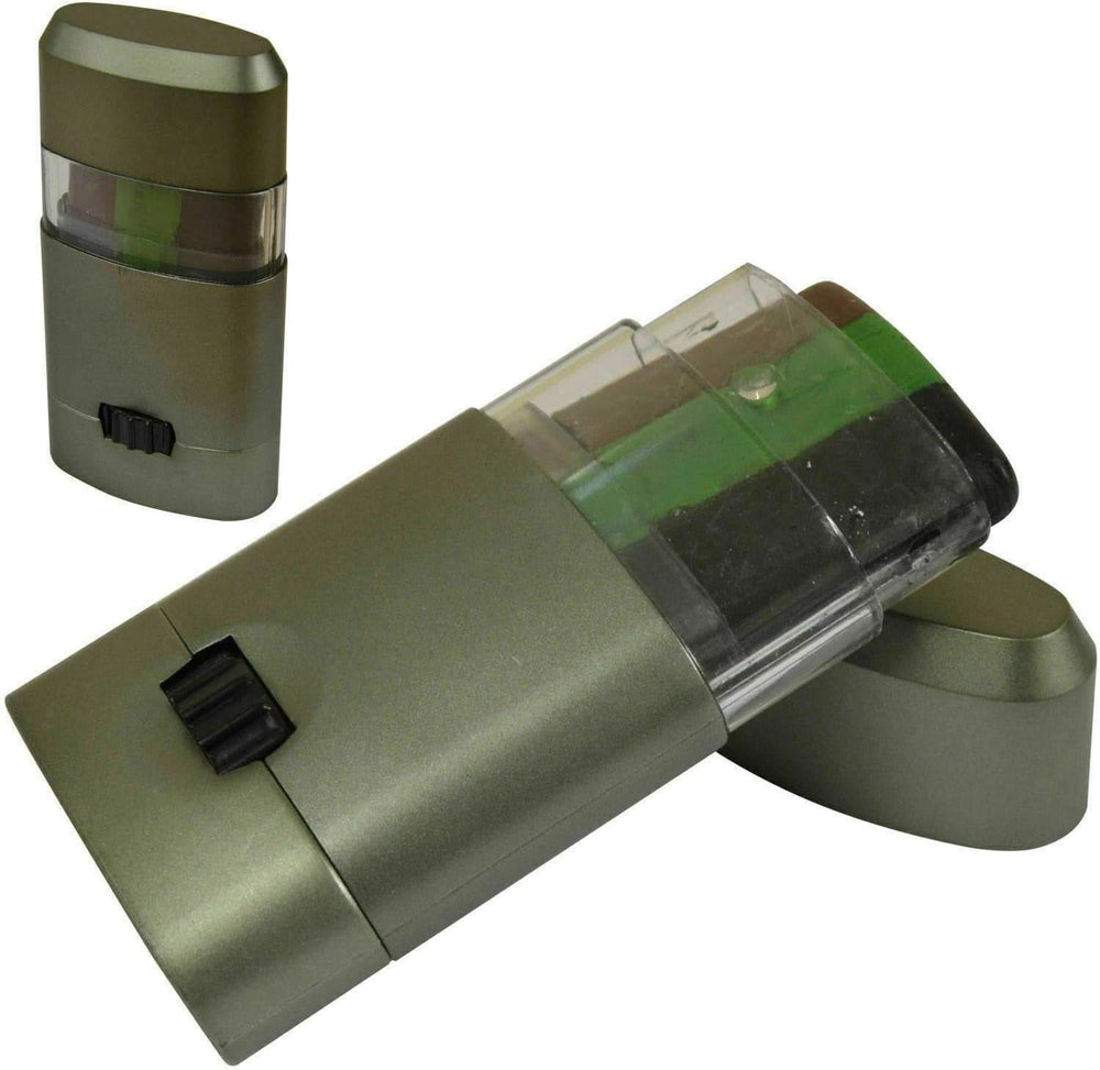 A compact camouflage face paint kit with multiple green shades, housed in a metal container with a clear plastic window.