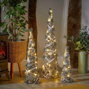 Decorative Christmas trees with lights in a home setting