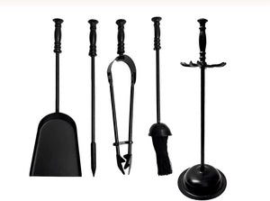 Set of black fireplace tools including a shovel, tongs, and poker on a white background