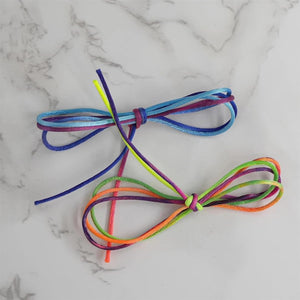 Colorful shoelaces on a marble surface