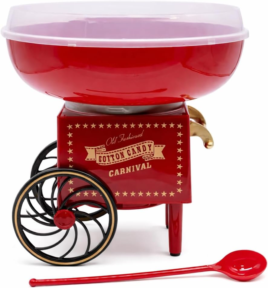 Red cotton candy maker with a bowl of cotton candy on a table.