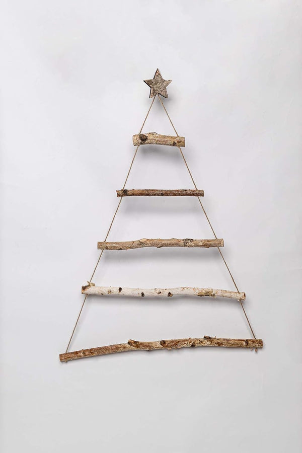 Wooden Christmas tree decoration with a star on a white background
