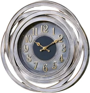 Decorative wall clock with spiral design and gold accents on a white background