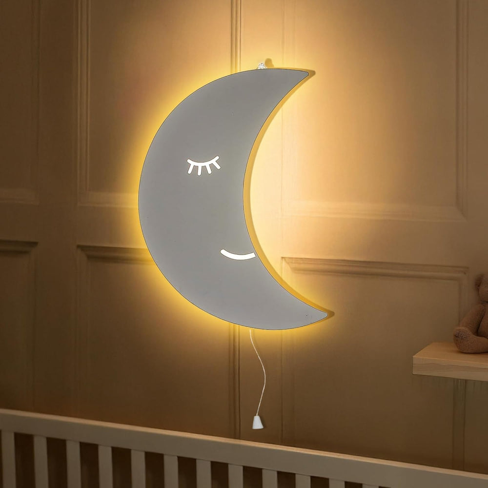Moon-shaped night light on a wall in a room setting