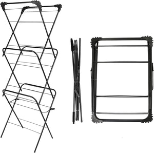 Black metal drying rack with adjustable shelves on a white background