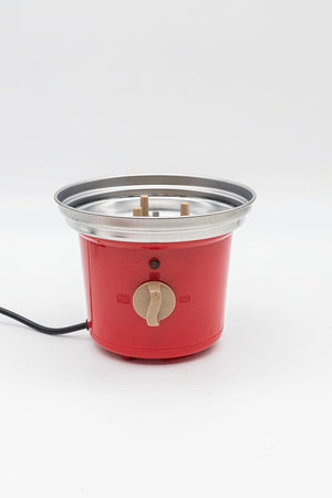 Red electric hot pot with a silver lid on a white background