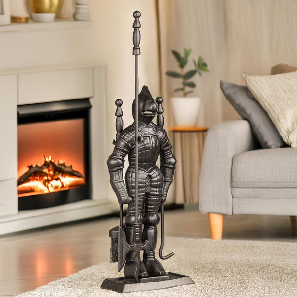 Decorative metal knight statue in a living room with a fireplace and sofa.