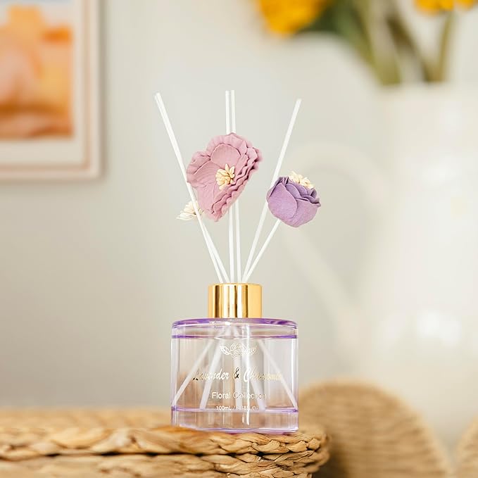 Decorative diffuser with floral elements on a blurred background