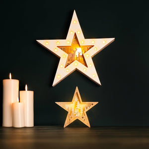 Decorative star lights with candles on a dark background