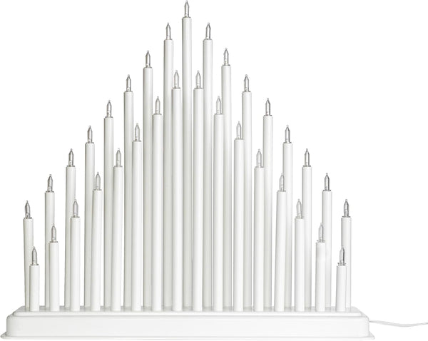 White candle-like lamp with multiple vertical lights on a white background