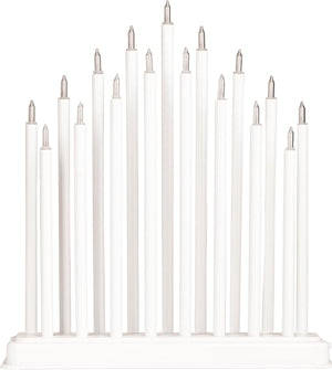 Set of white candles on a white background