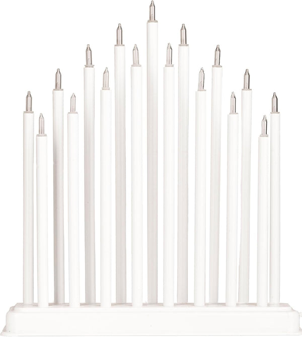 Set of white candles on a white background