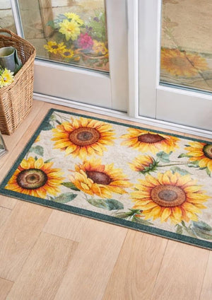 Decorative rug with sunflower design on a wooden floor.