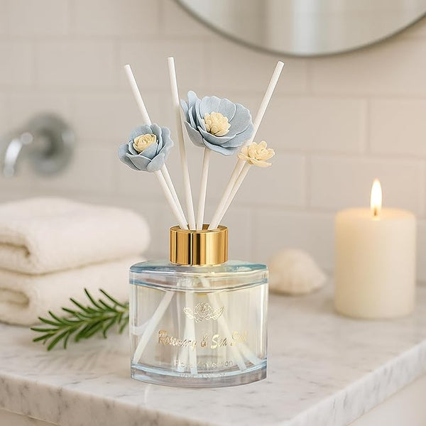 Reed diffuser with floral design on a bathroom counter