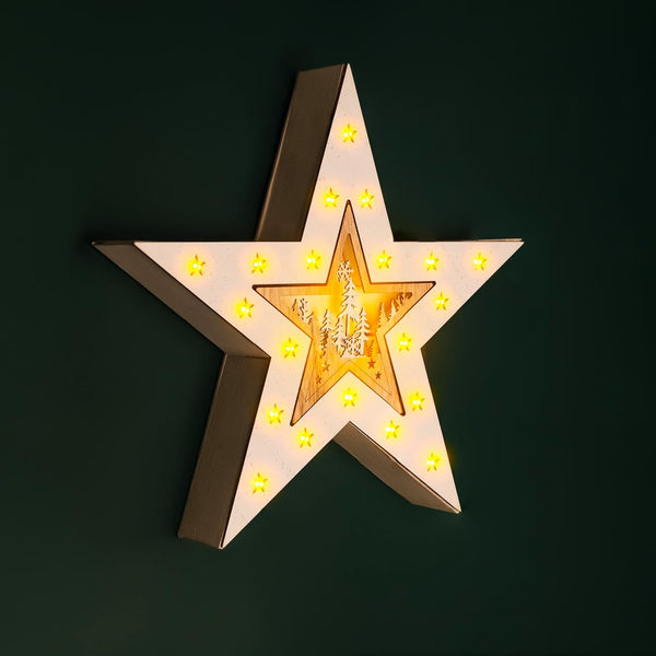 Star-shaped light fixture with glowing interior on a dark background