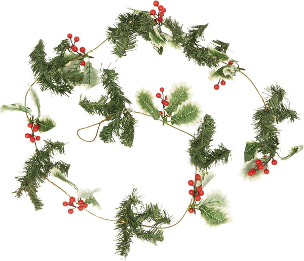 Decorative Christmas garland with green foliage and red berries on a white background