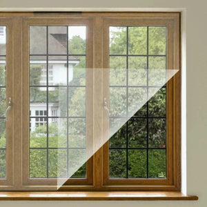 Window with a clear film applied to the glass