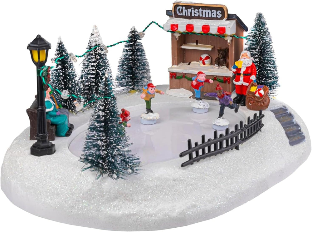 Christmas-themed miniature scene with trees, Santa Claus, and lights on a dark background