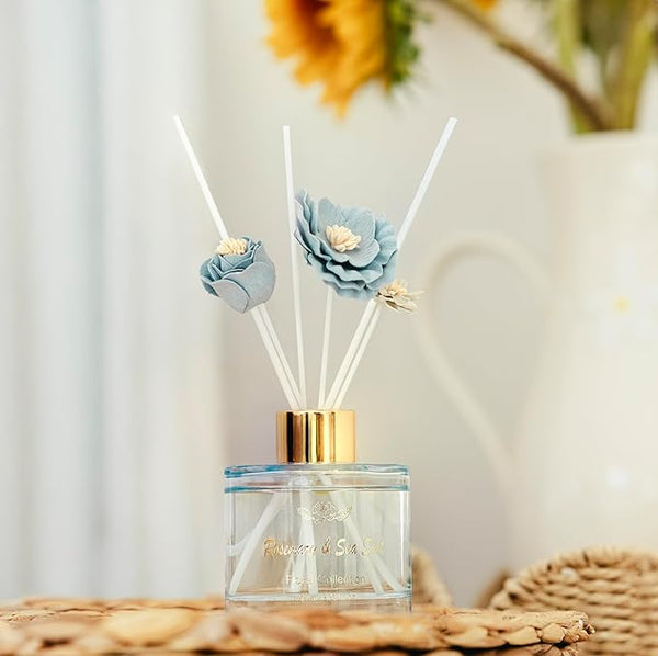 Diffuser with floral design on top against a blurred background