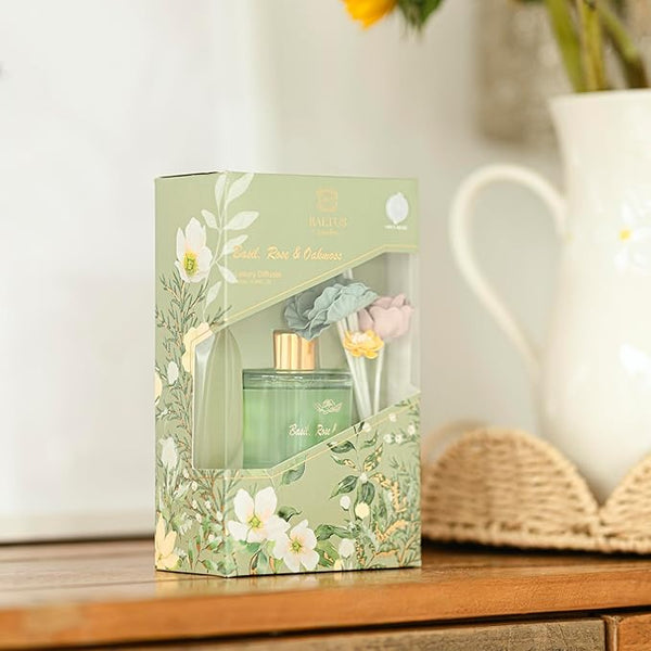 Green floral gift set packaging on a wooden surface with a blurred background