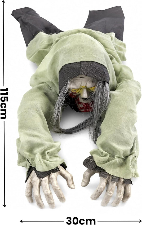 A crawling zombie Halloween decoration with a pale green tattered robe, gray hair, a bloody face, and skeletal hands, shown on a white background with height and width measurement markers.