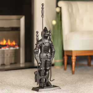 Decorative knight statue in front of a fireplace