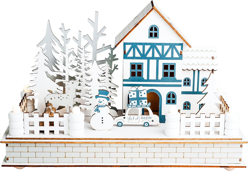 Wooden Christmas village scene with a house, trees, and car on a wooden base.